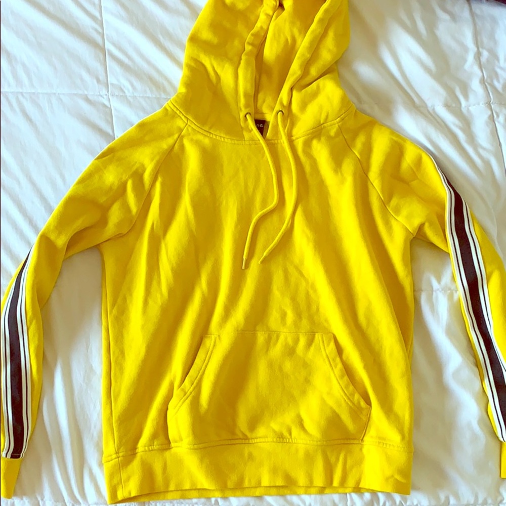 Yellow sweatshirt with arm stripes